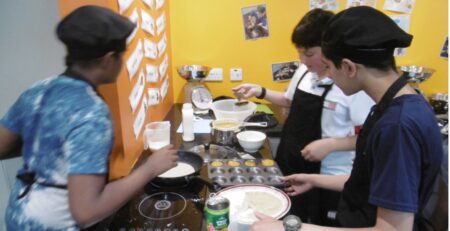 Year 6 pupils making pancakes